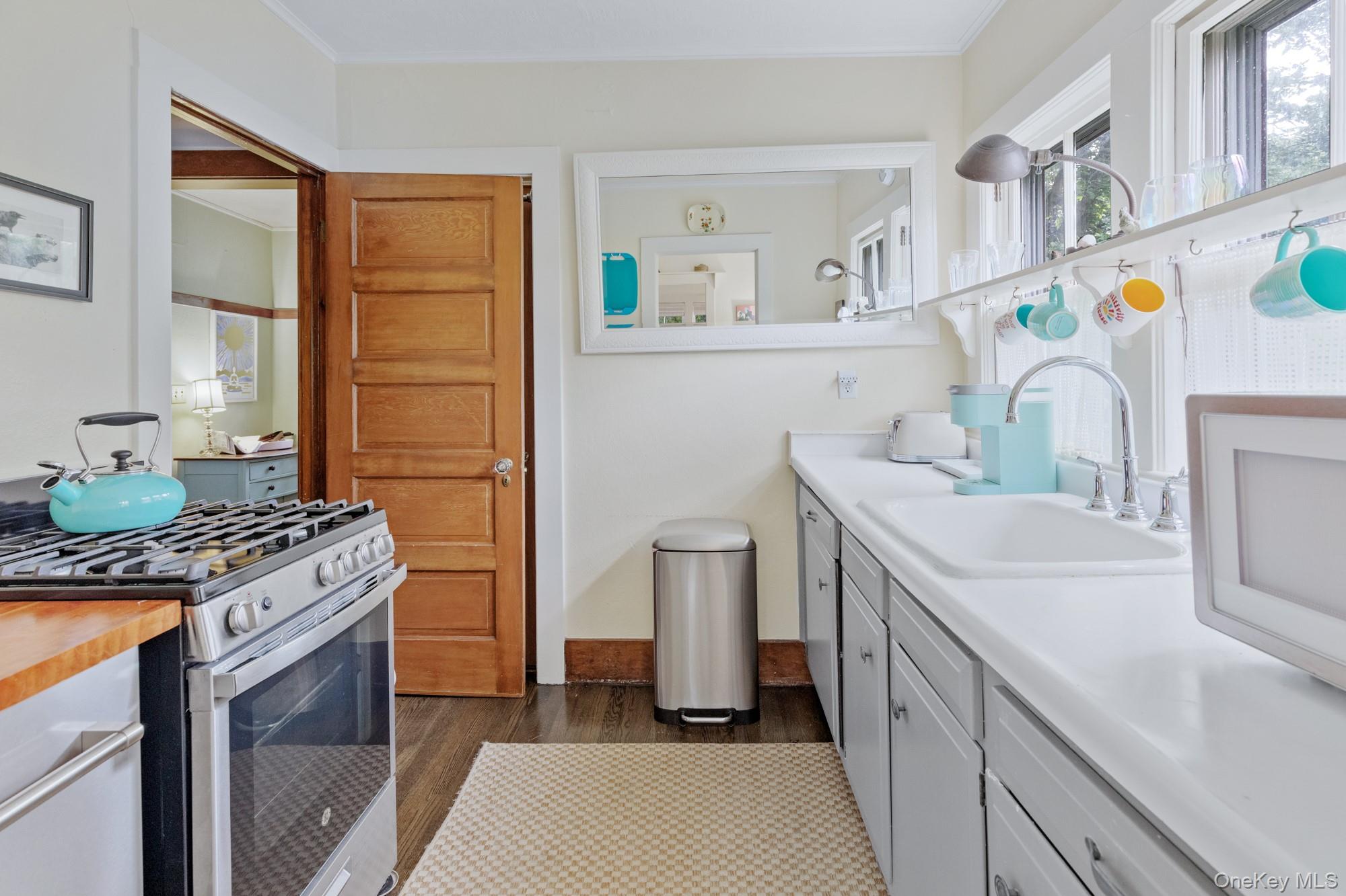 10 Pleasant Lane East Hampton, NY 11937 - Photo 9 of 15 a kitchen with a sink stove and refrigerator