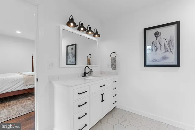 a bathroom with a sink double vanity and tub