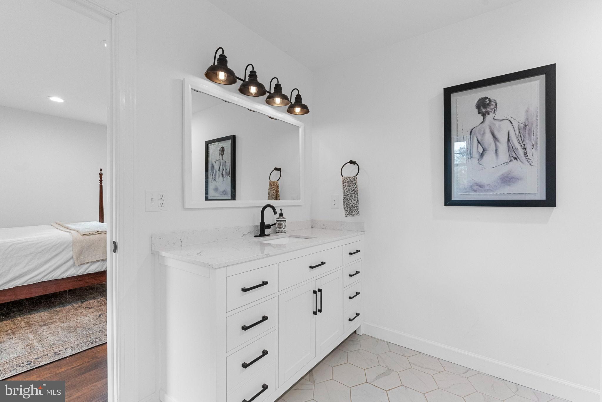 21287 Sparta Road Milford, VA 22514 - Photo 20 of 35 Sleek bathroom with modern elegance.