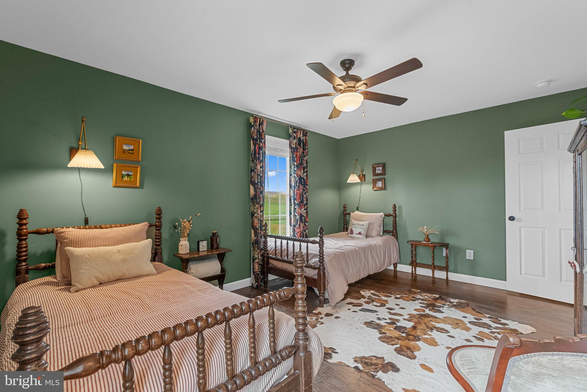 21287 Sparta Road Milford, VA 22514 - Photo 28 of 35 Charming dual bedroom with rustic elegance.