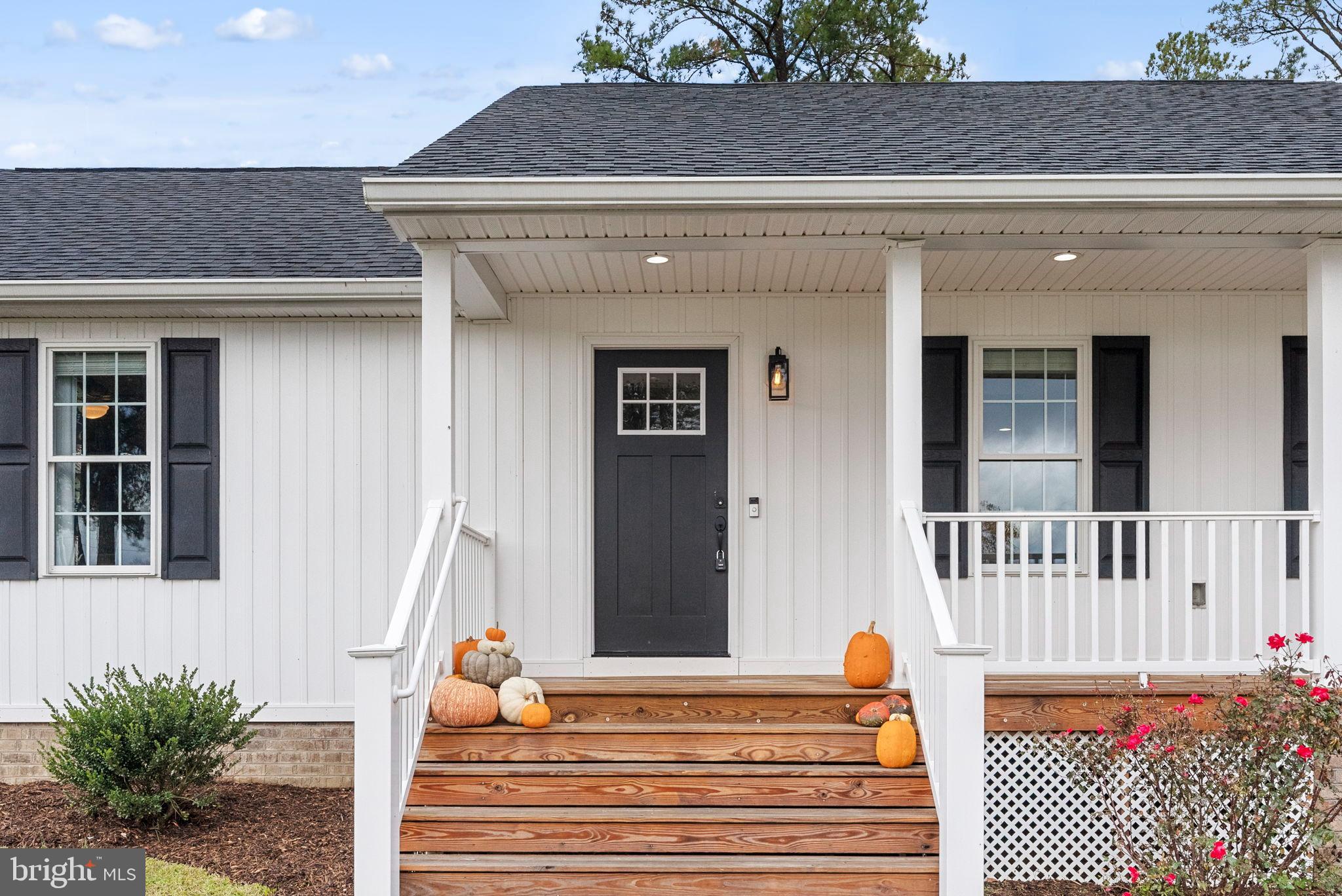 21287 Sparta Road Milford, VA 22514 - Photo 3 of 35 Charming entrance adorned with autumn hues.