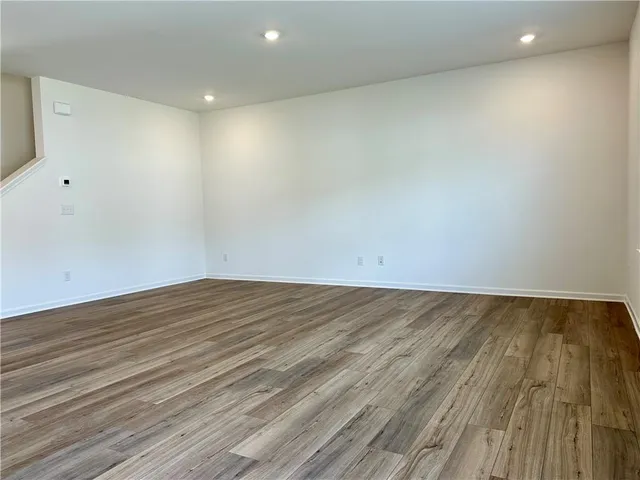 a kitchen with stainless steel appliances a refrigerator stove microwave and sink