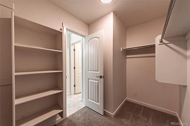 a view of an empty walk in closet