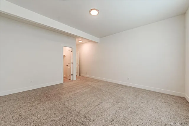 an empty room with a bathroom