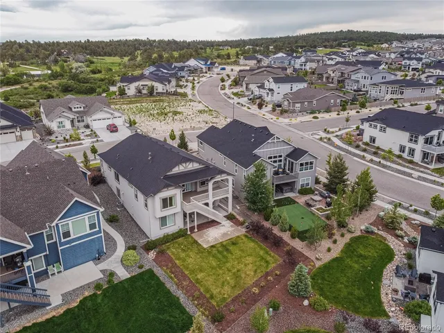 an aerial view of residential houses and outdoor space