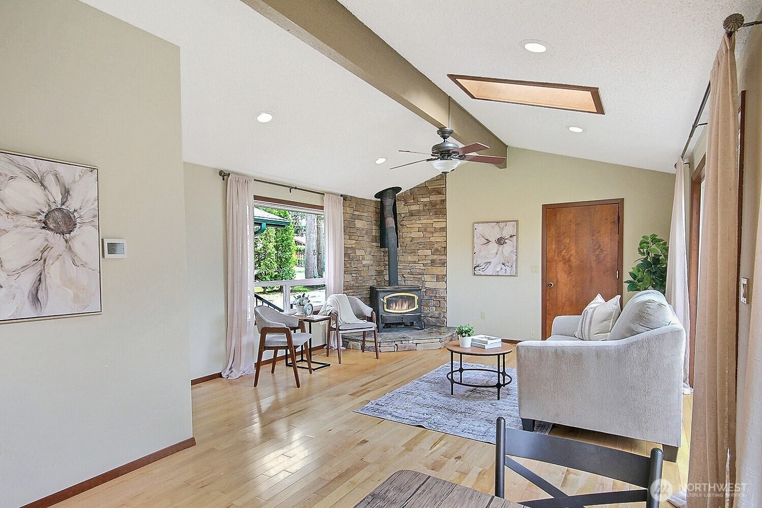 21834 Southeast 265th Way Maple Valley, WA 98038 - Photo 16 of 31 a living room with furniture and wooden floor