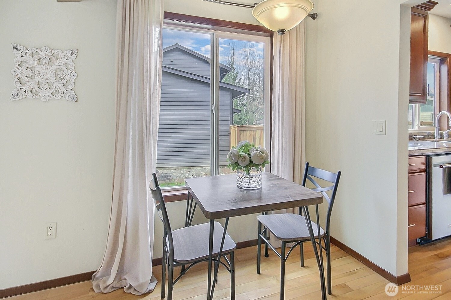 21834 Southeast 265th Way Maple Valley, WA 98038 - Photo 17 of 31 a view of a dining room with furniture and window