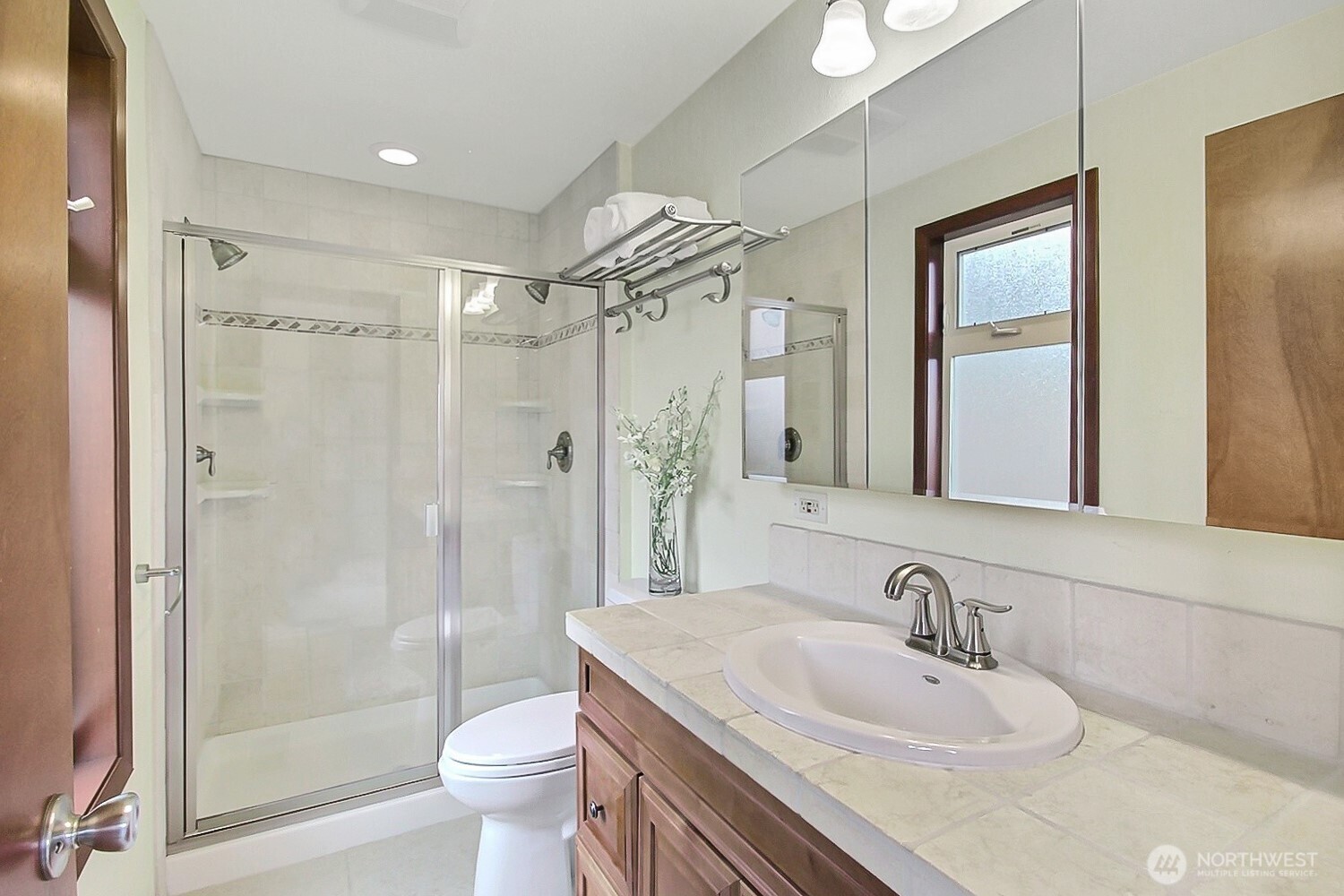 21834 Southeast 265th Way Maple Valley, WA 98038 - Photo 19 of 31 a bathroom with a sink toilet tub and shower