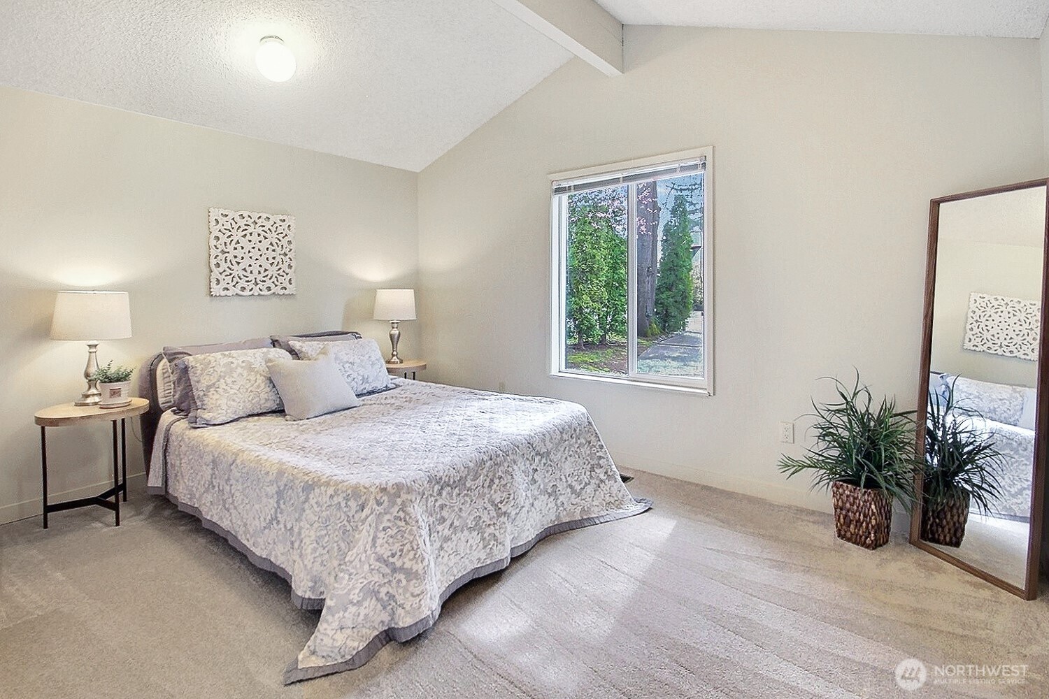 21834 Southeast 265th Way Maple Valley, WA 98038 - Photo 20 of 31 a bedroom with a bed and a potted plant