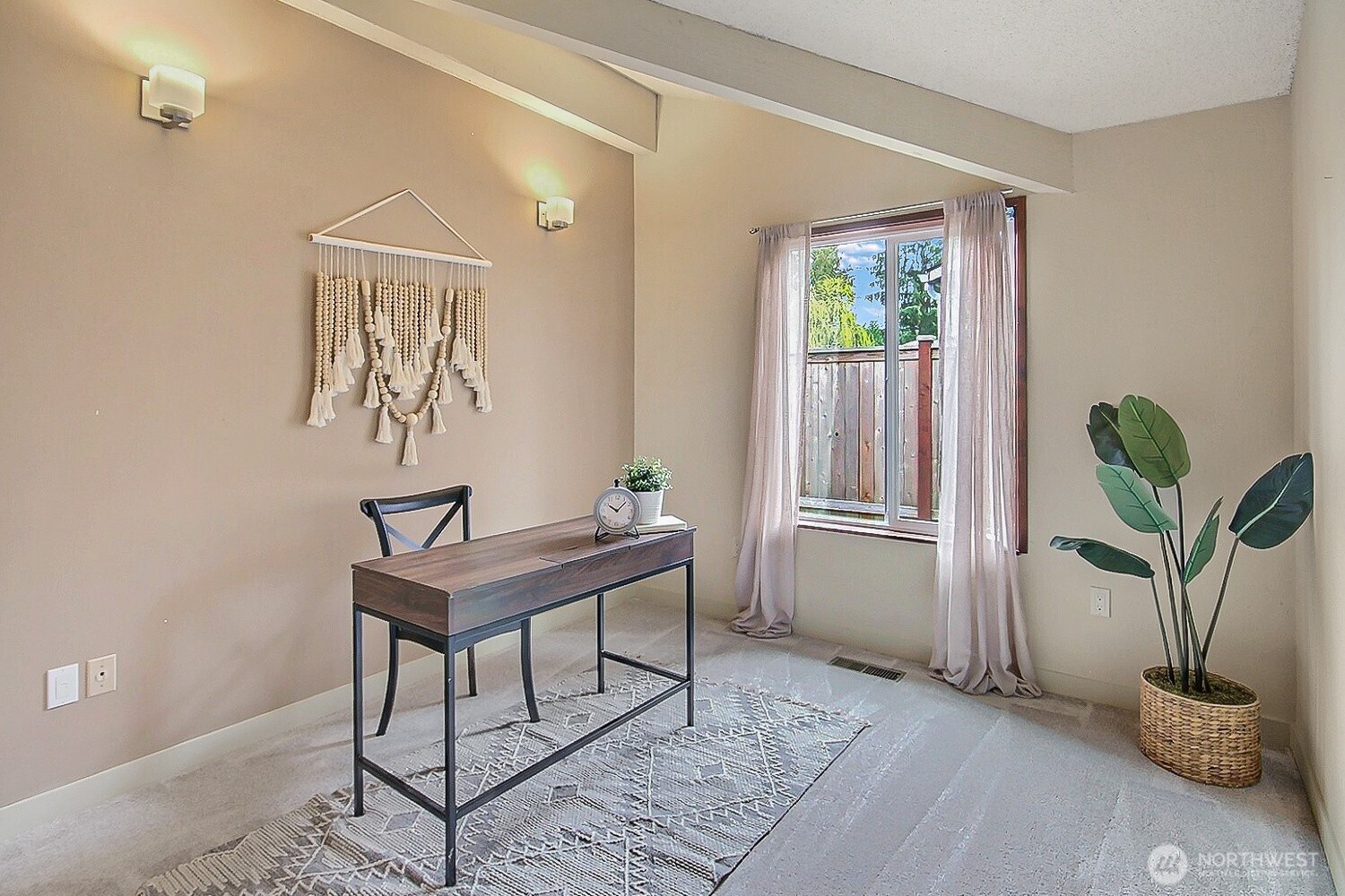 21834 Southeast 265th Way Maple Valley, WA 98038 - Photo 21 of 31 a view of a workspace room with wooden floor and a potted plant