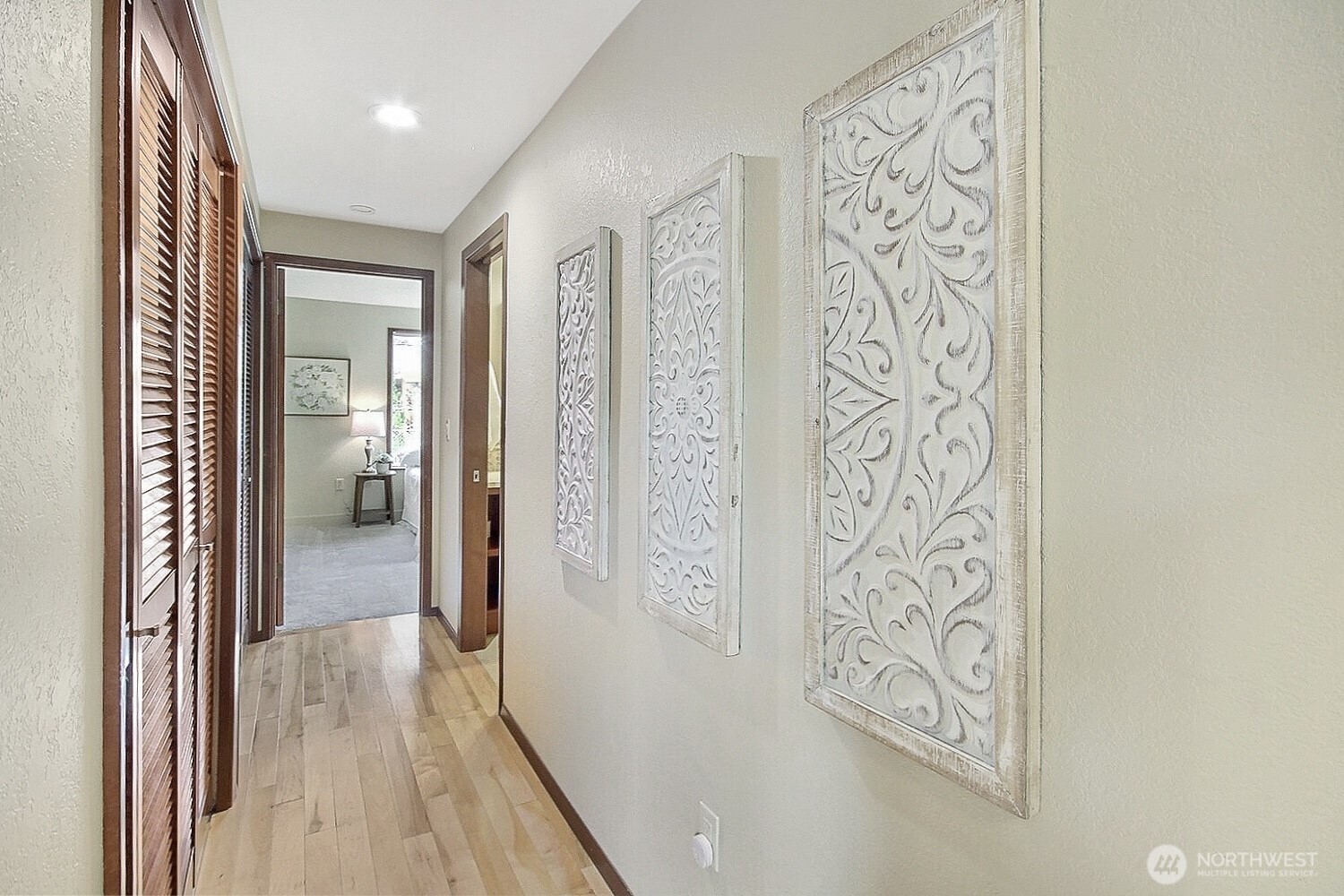 21834 Southeast 265th Way Maple Valley, WA 98038 - Photo 23 of 31 a view of a hallway with wooden floor and closet