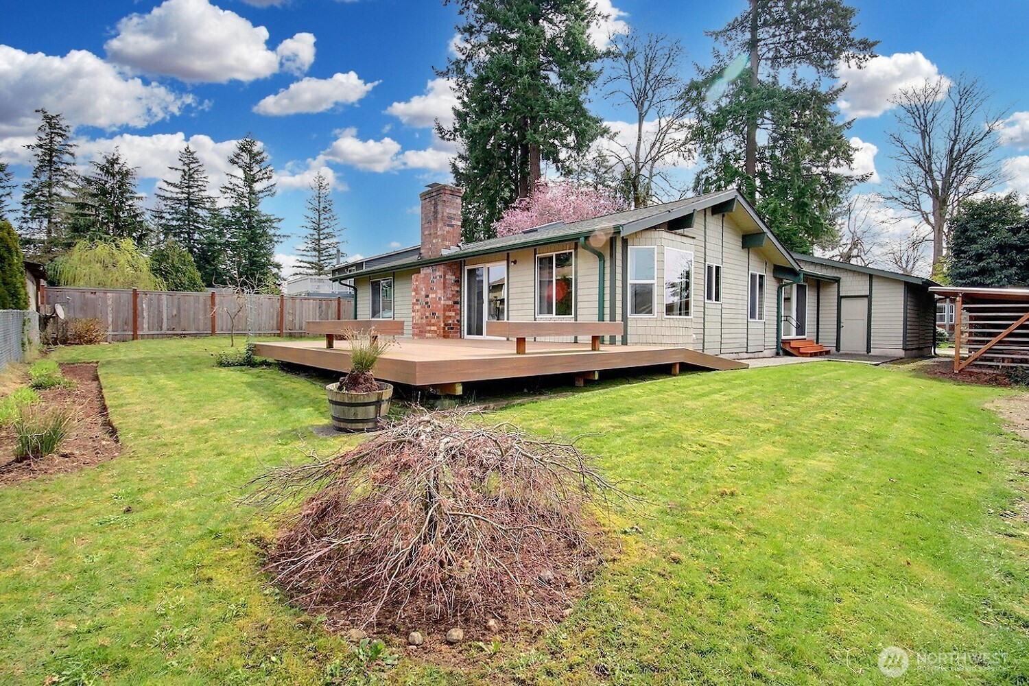 21834 Southeast 265th Way Maple Valley, WA 98038 - Photo 24 of 31 a view of a house with a yard and sitting area