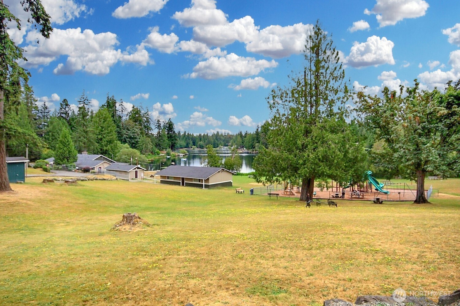 21834 Southeast 265th Way Maple Valley, WA 98038 - Photo 29 of 31 a view of a swimming pool with an outdoor space and seating area