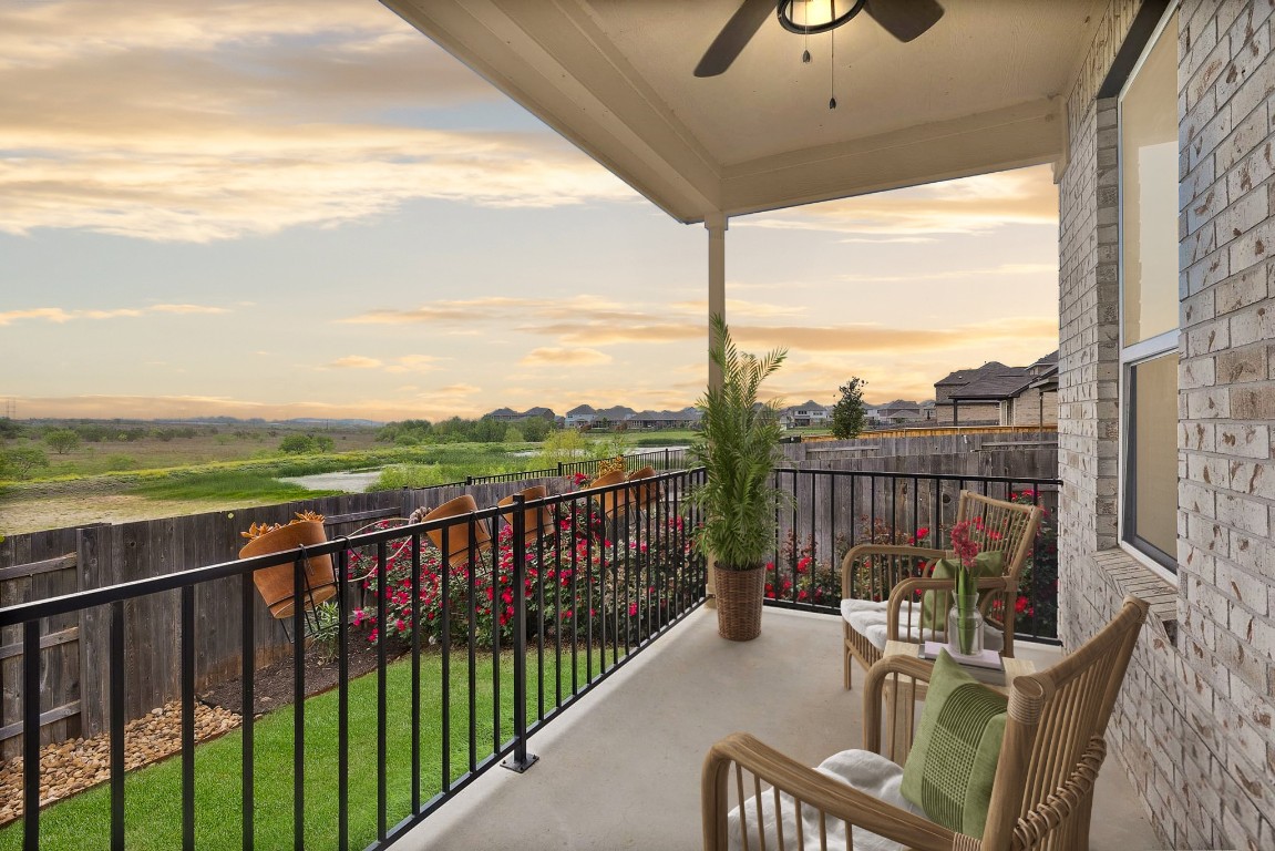 a view of a balcony with furniture