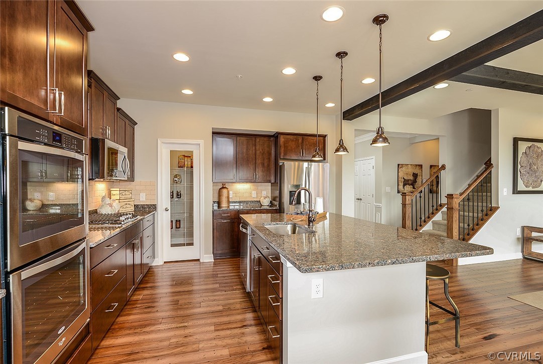 9113 Moldova Road Chesterfield, VA 23832 - Photo 3 of 19 a large kitchen with stainless steel appliances granite countertop plenty wooden cabinets counter space and a sink