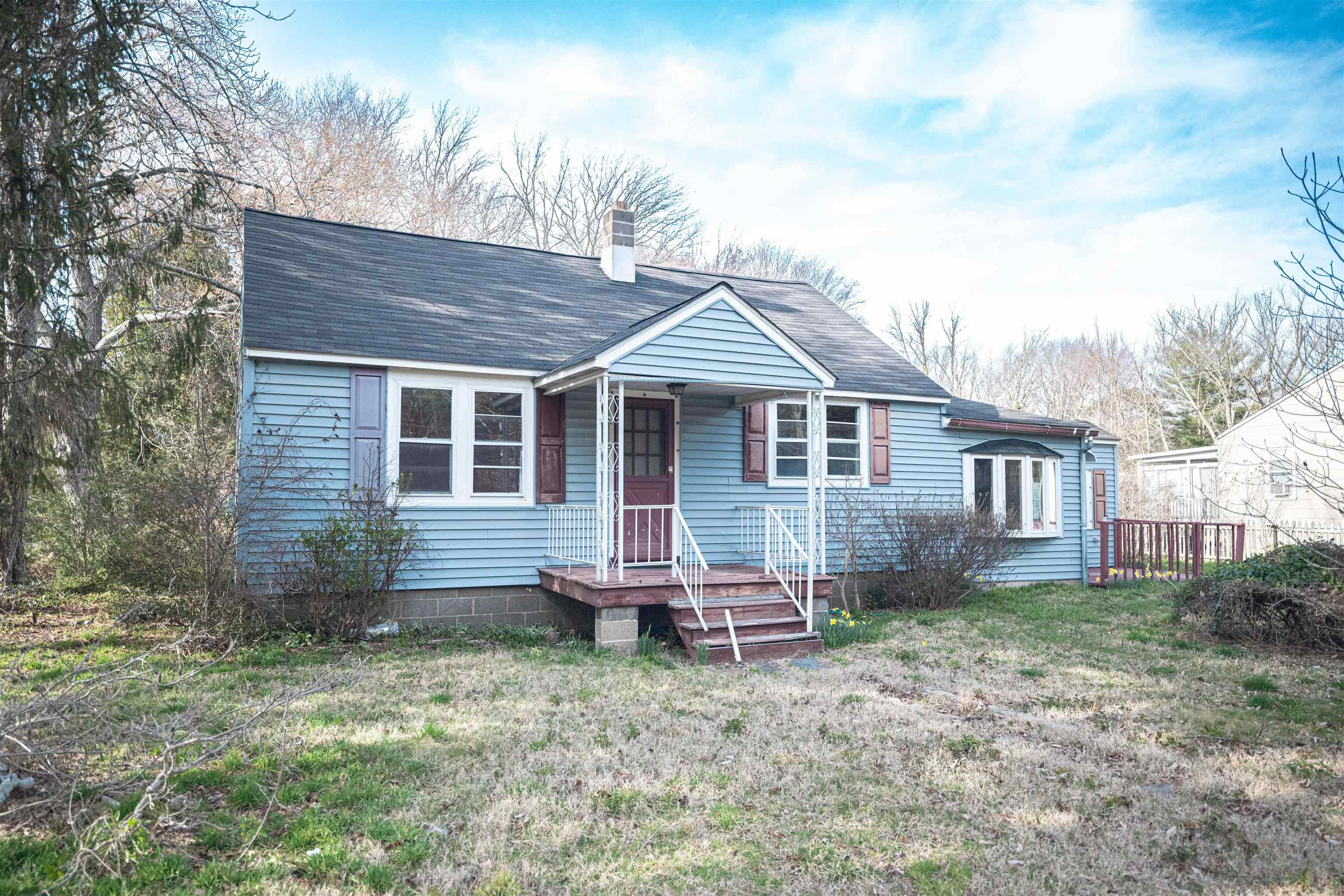 768 Seashore Road Cape May, NJ 08204 - Photo 1 of 12 a backyard of a house with wooden fence and large trees