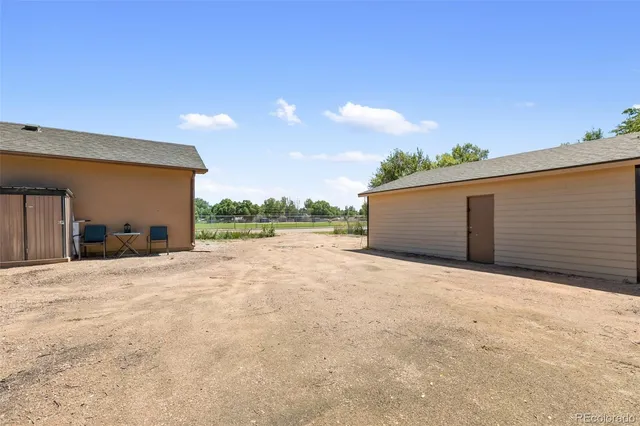 a view of a house with a yard and garage
