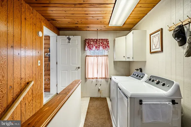 a room with gym equipment and windows