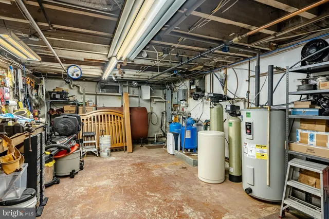 a view of a house with a yard patio and swimming pool