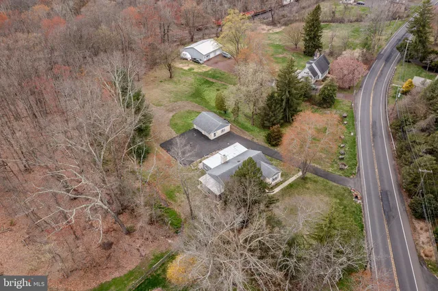 a aerial view of a house with a yard