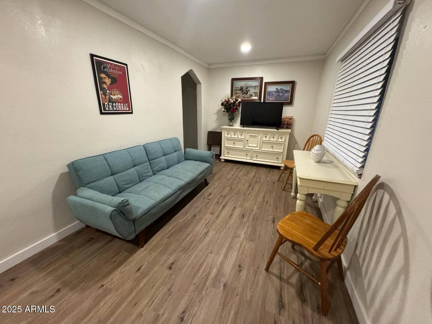 19 West Fremont Street, Unit 4 Tombstone, AZ 85638 - Photo 4 of 14 a living room with furniture and a wooden floor