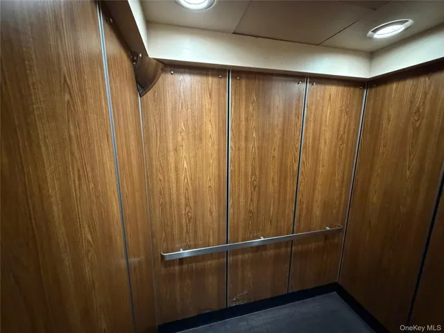 a view of a hallway with stairs