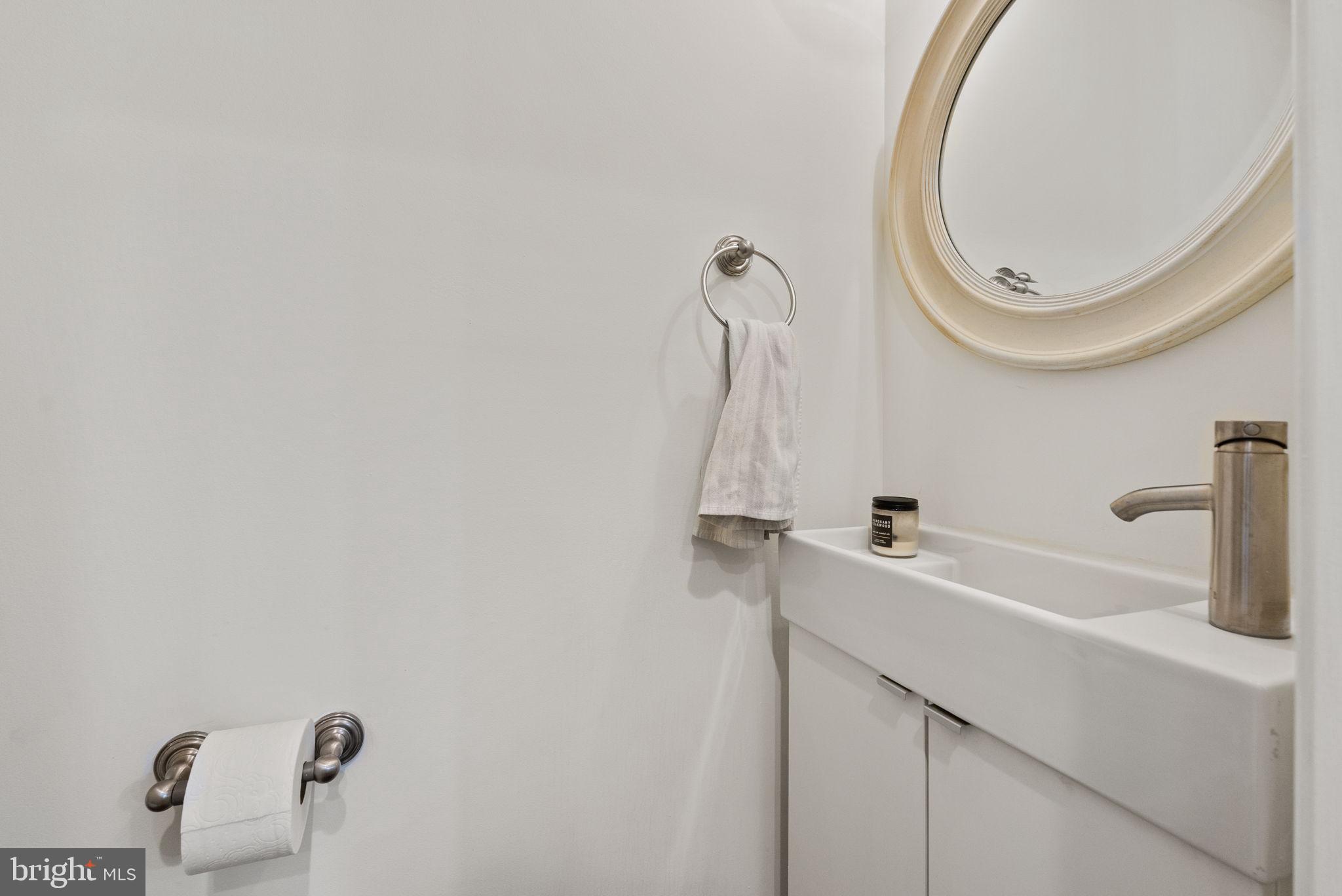 2000 East A Street Northeast Washington, DC 20002 - Photo 14 of 26 a bathroom with a sink and a mirror