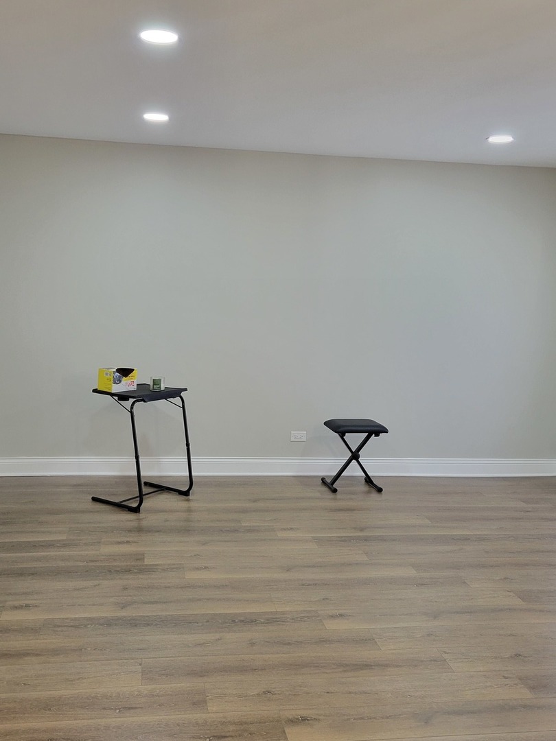 1100 Holbrook Road, Unit H Homewood, IL 60430 - Photo 3 of 13 a view of a bench in wooden floor