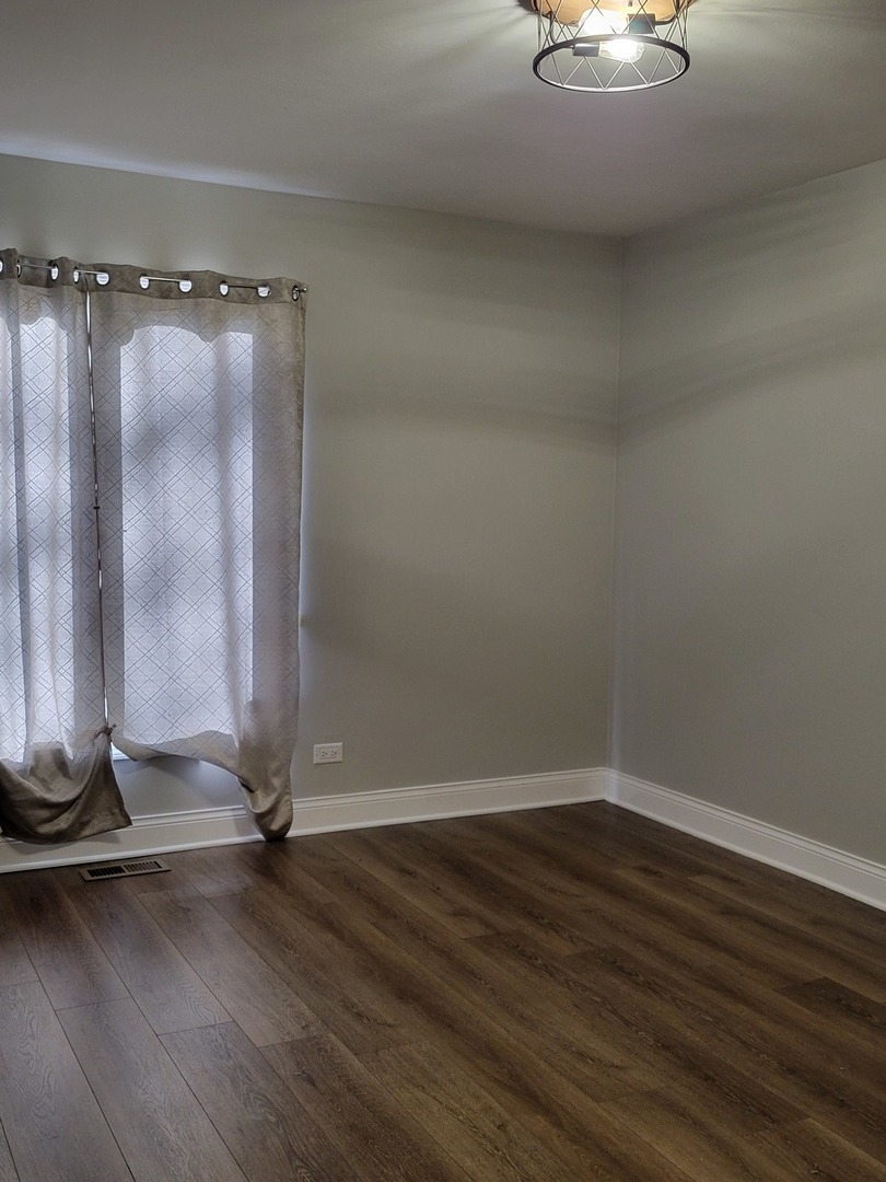 1100 Holbrook Road, Unit H Homewood, IL 60430 - Photo 9 of 13 a view of a room with wooden floor