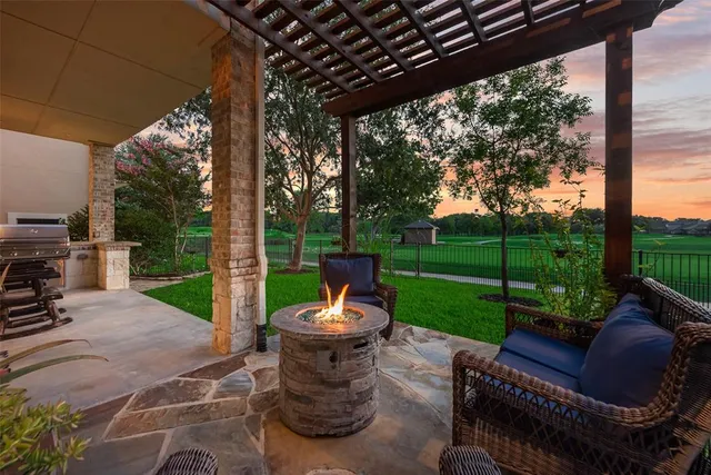 a view of a patio with couches chairs and a yard