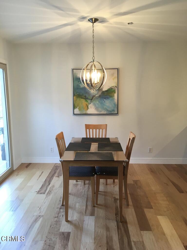1711 Masthead Drive Oxnard, CA 93035 - Photo 9 of 28 a view of a dining room with furniture window and wooden floor