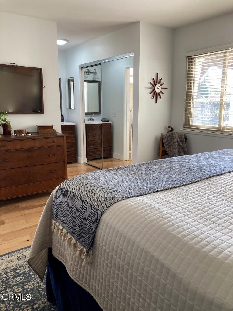 1711 Masthead Drive Oxnard, CA 93035 - Photo 10 of 28 a bedroom with a bed and a flat screen tv