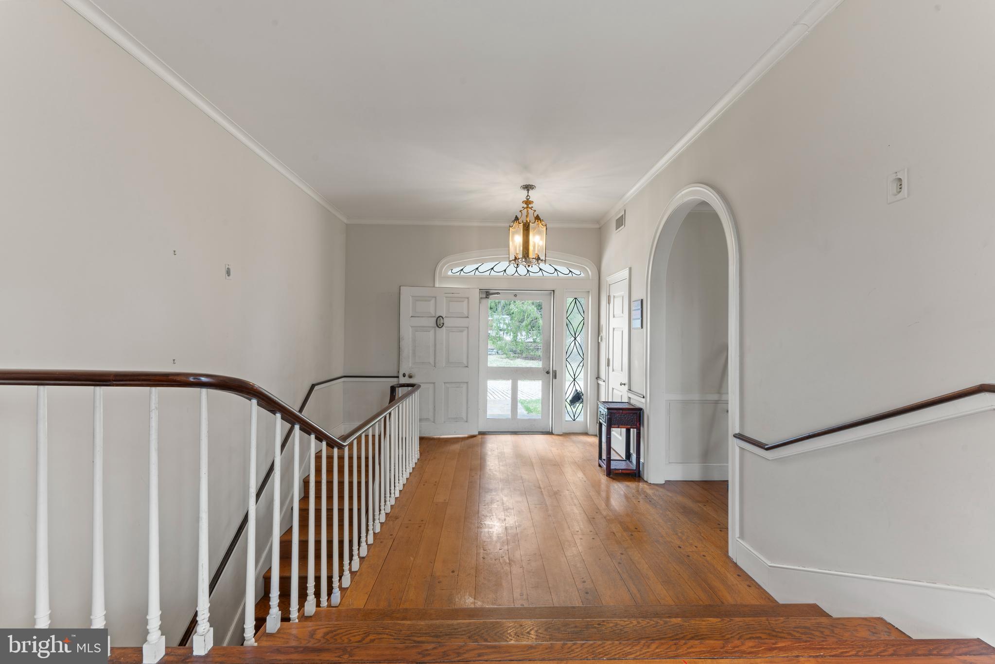 2141 Paper Mill Road Huntingdon Valley, PA 19006 - Photo 12 of 58 a view of a hallway with wooden floor and staircase
