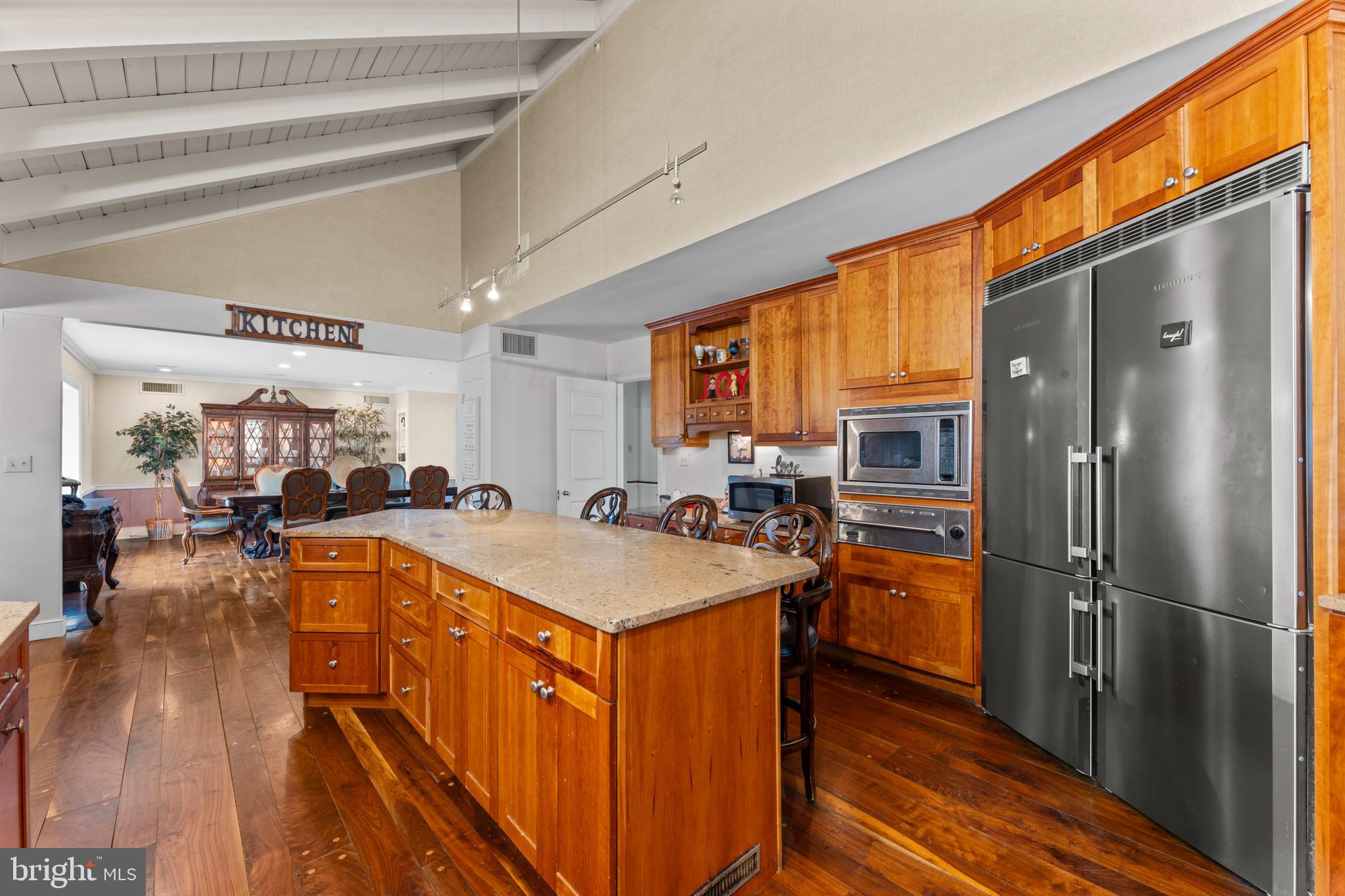 2141 Paper Mill Road Huntingdon Valley, PA 19006 - Photo 23 of 58 a kitchen with stainless steel appliances granite countertop a refrigerator a sink dishwasher a stove and white countertops with wooden floor