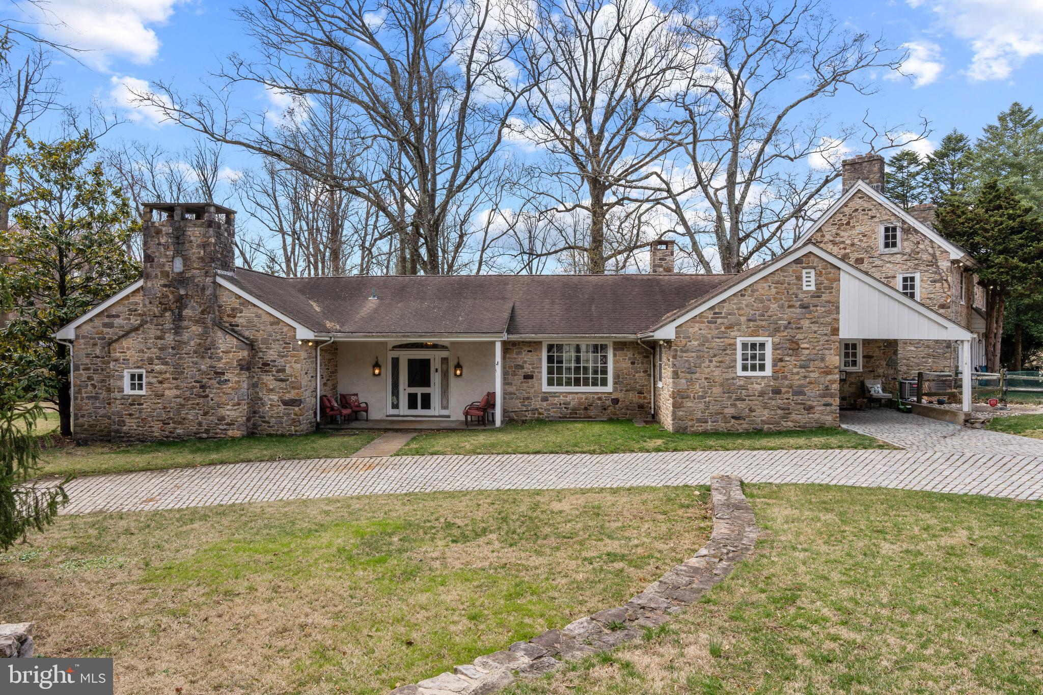 2141 Paper Mill Road Huntingdon Valley, PA 19006 - Photo 3 of 58 a front view of a house with a yard