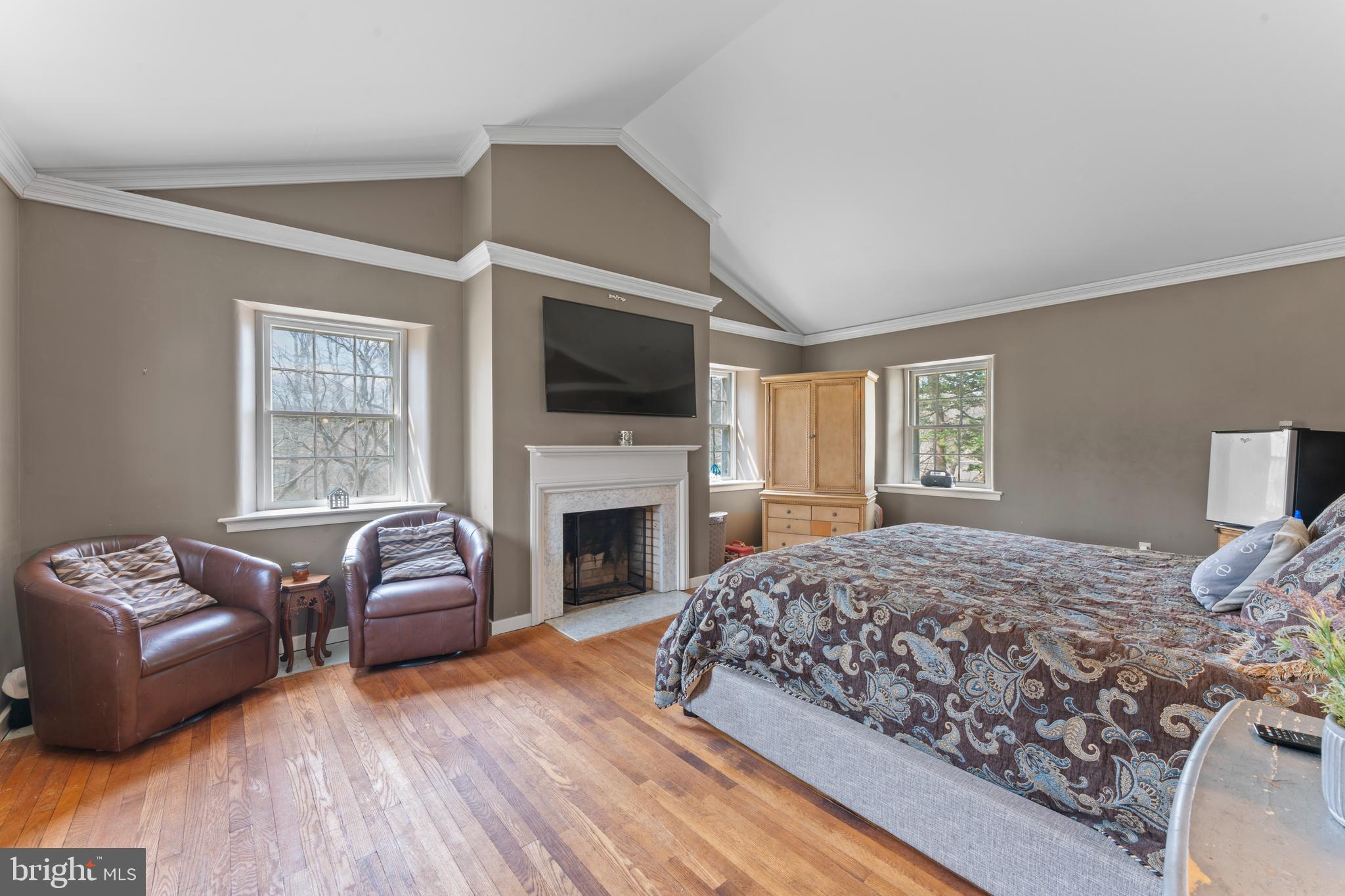 2141 Paper Mill Road Huntingdon Valley, PA 19006 - Photo 31 of 58 a bedroom with a bed couches and a flat screen tv