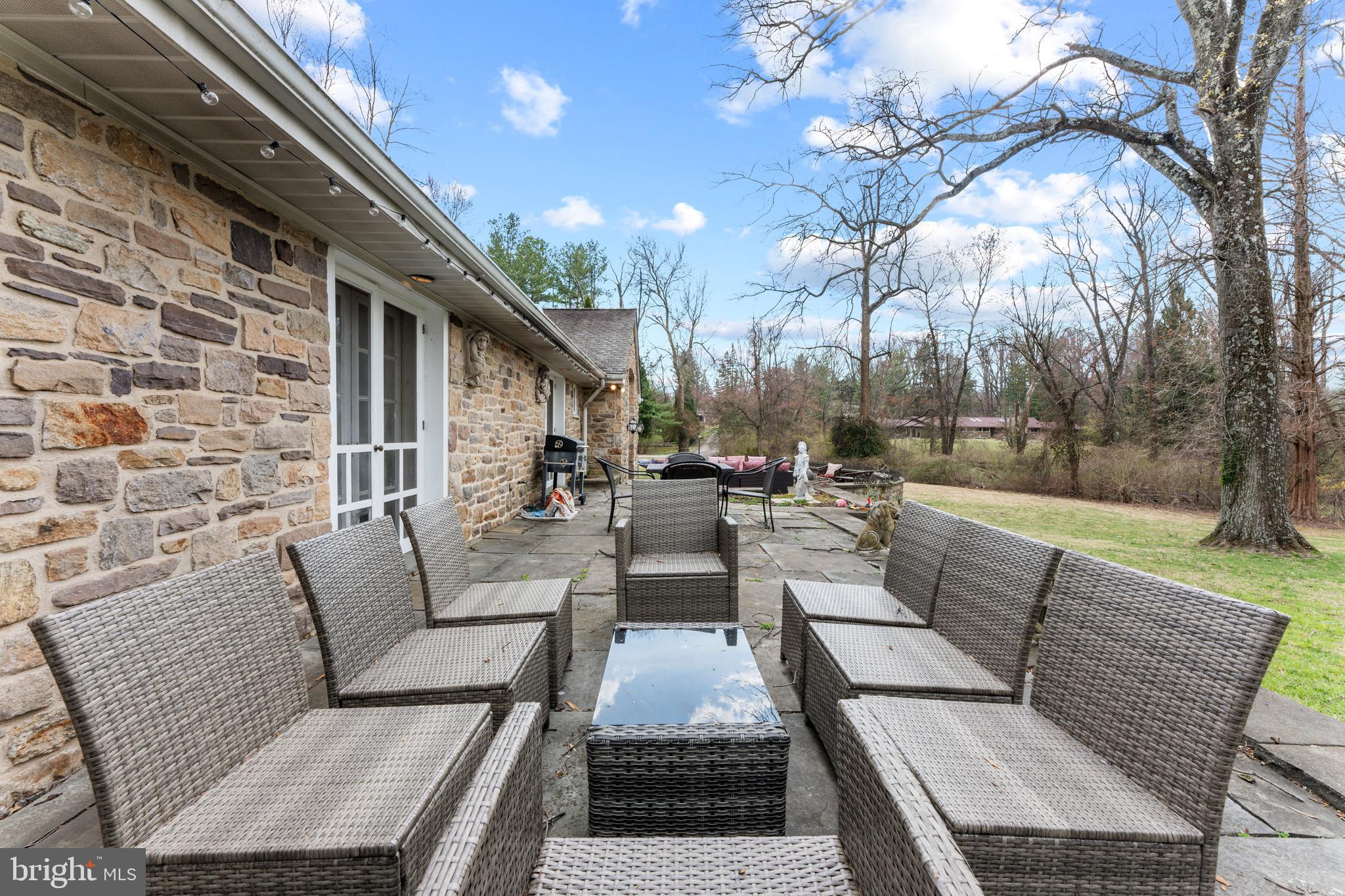 2141 Paper Mill Road Huntingdon Valley, PA 19006 - Photo 36 of 58 a view of patio with couches and dining table with chairs