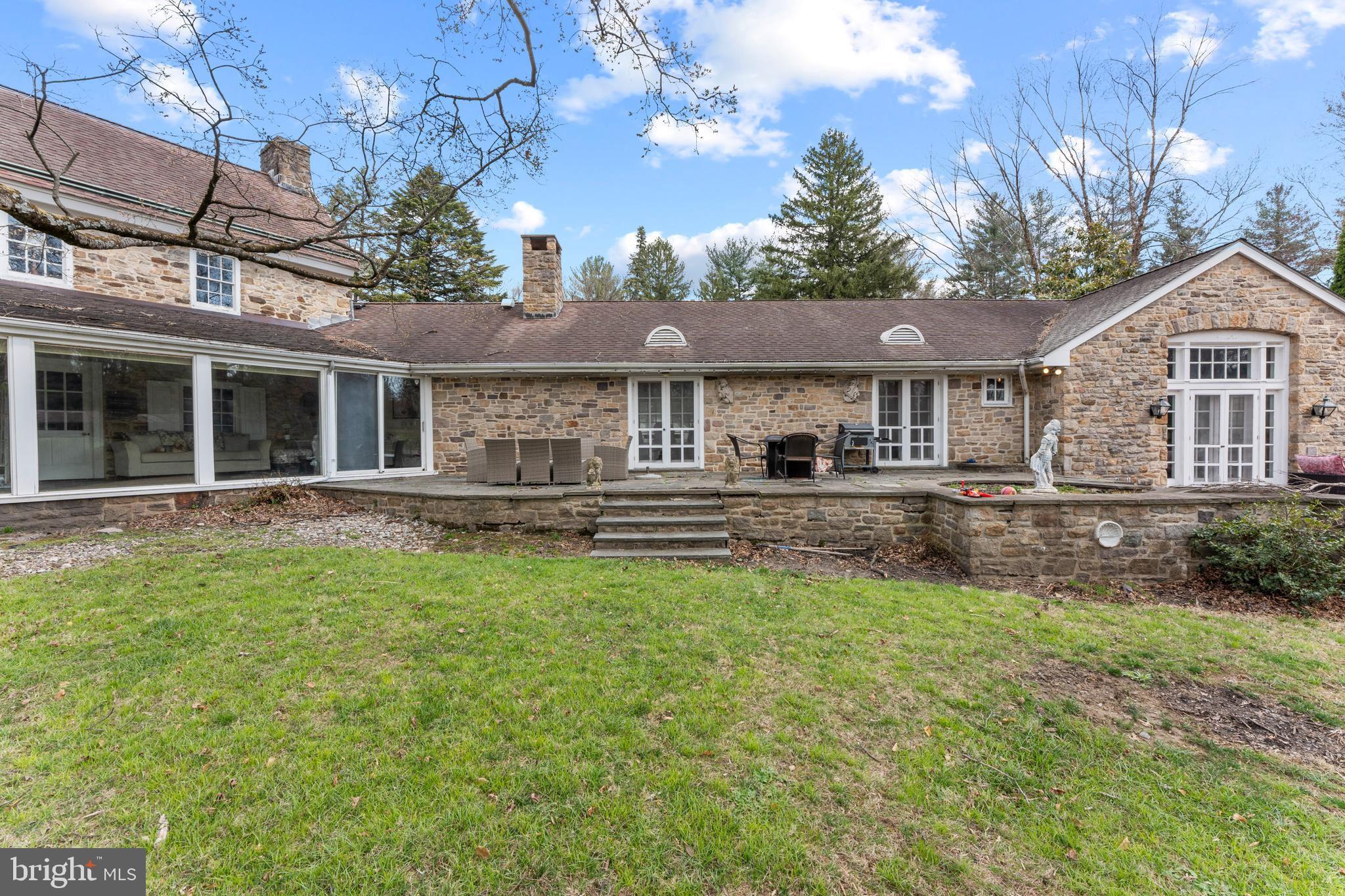 2141 Paper Mill Road Huntingdon Valley, PA 19006 - Photo 4 of 58 a front view of a house with a yard