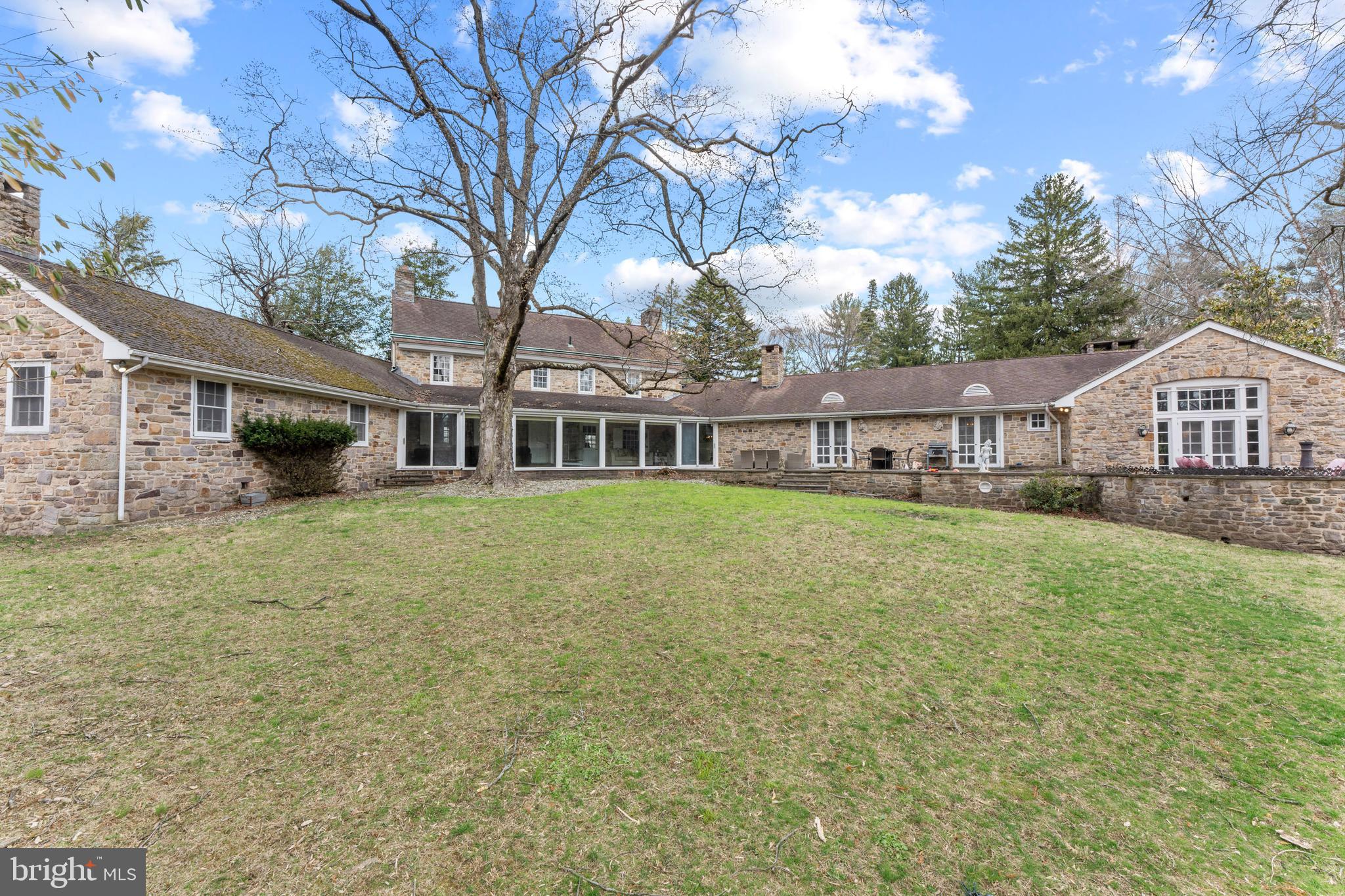 2141 Paper Mill Road Huntingdon Valley, PA 19006 - Photo 5 of 58 a front view of house with yard and green space