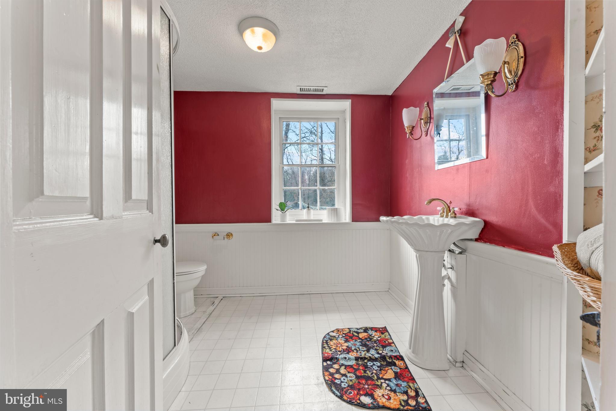 2141 Paper Mill Road Huntingdon Valley, PA 19006 - Photo 54 of 58 a bathroom with a bathtub and a window