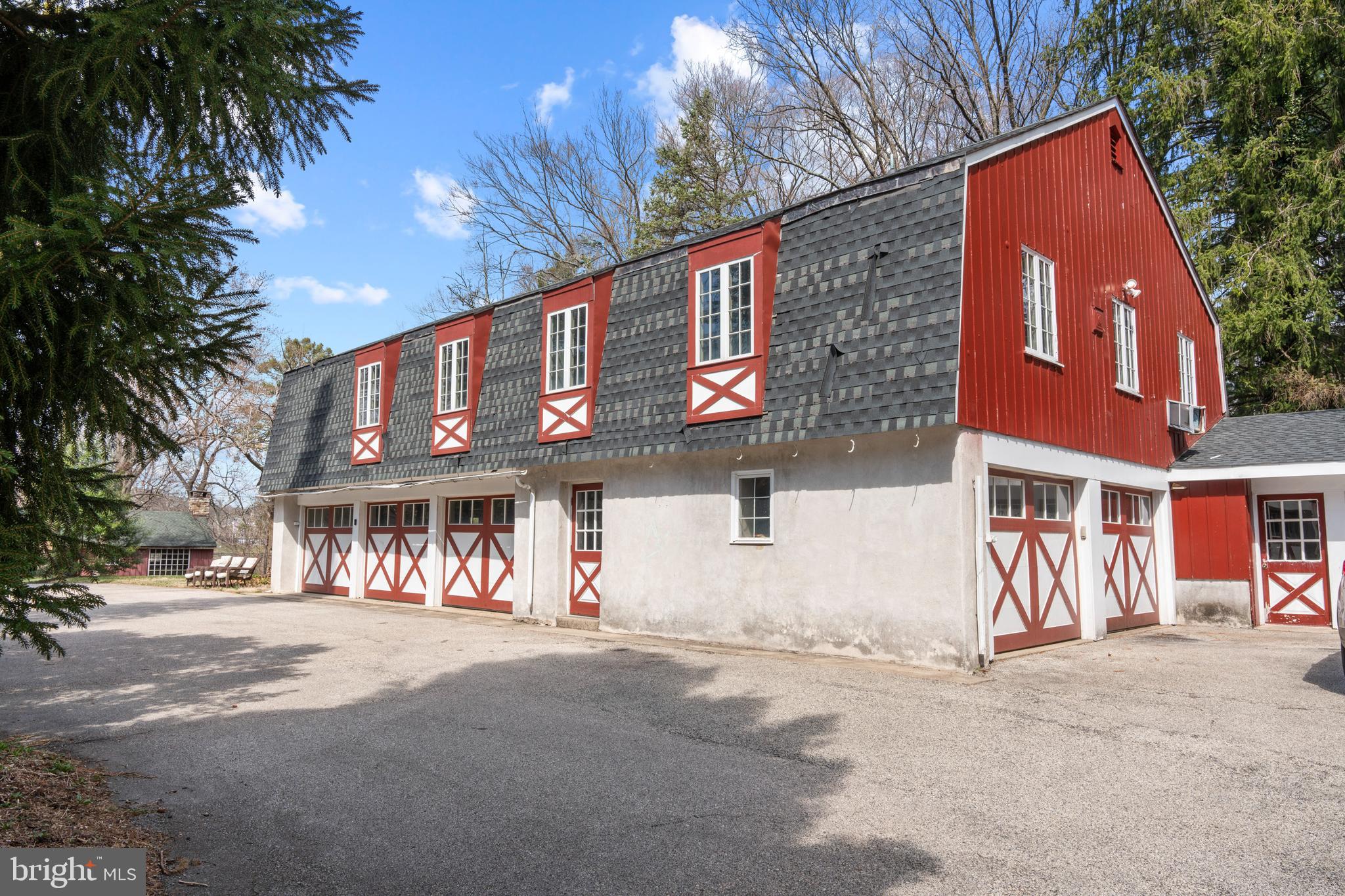2141 Paper Mill Road Huntingdon Valley, PA 19006 - Photo 6 of 58 a front view of a building with a tree
