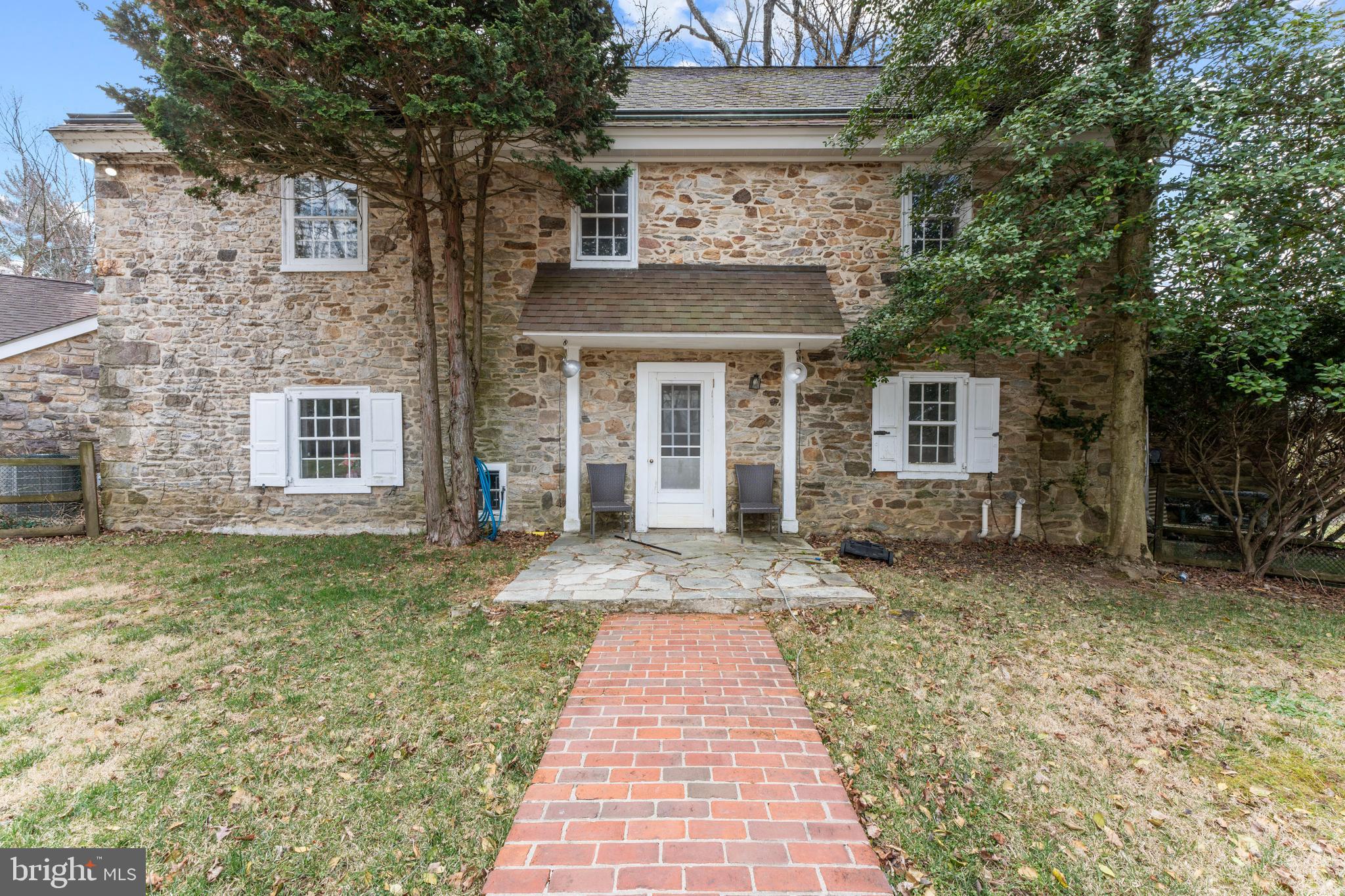2141 Paper Mill Road Huntingdon Valley, PA 19006 - Photo 9 of 58 a front view of a house with a garden