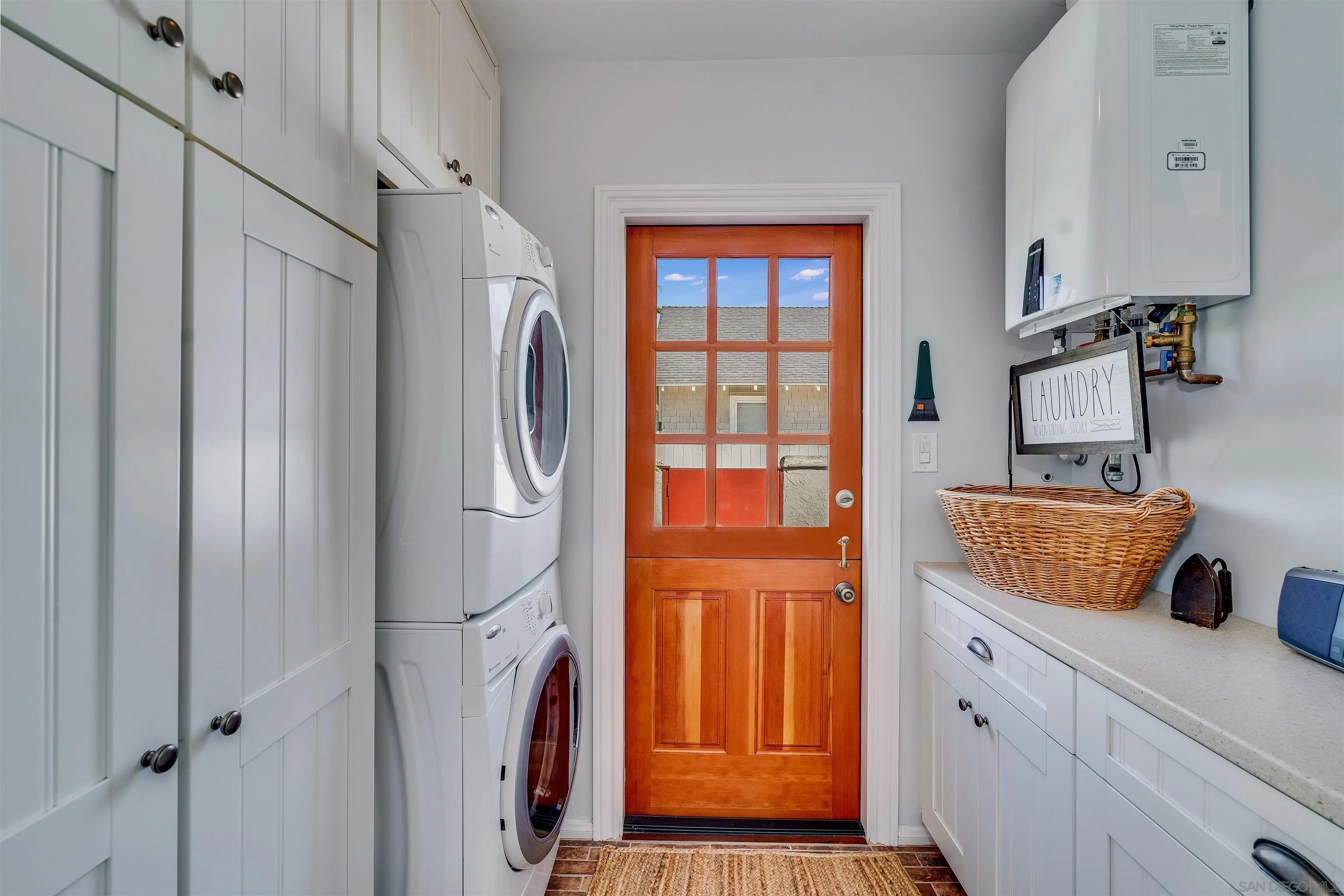 1210 Third Street Coronado, CA 92118 - Photo 14 of 40 a kitchen with stainless steel appliances granite countertop a refrigerator and a sink