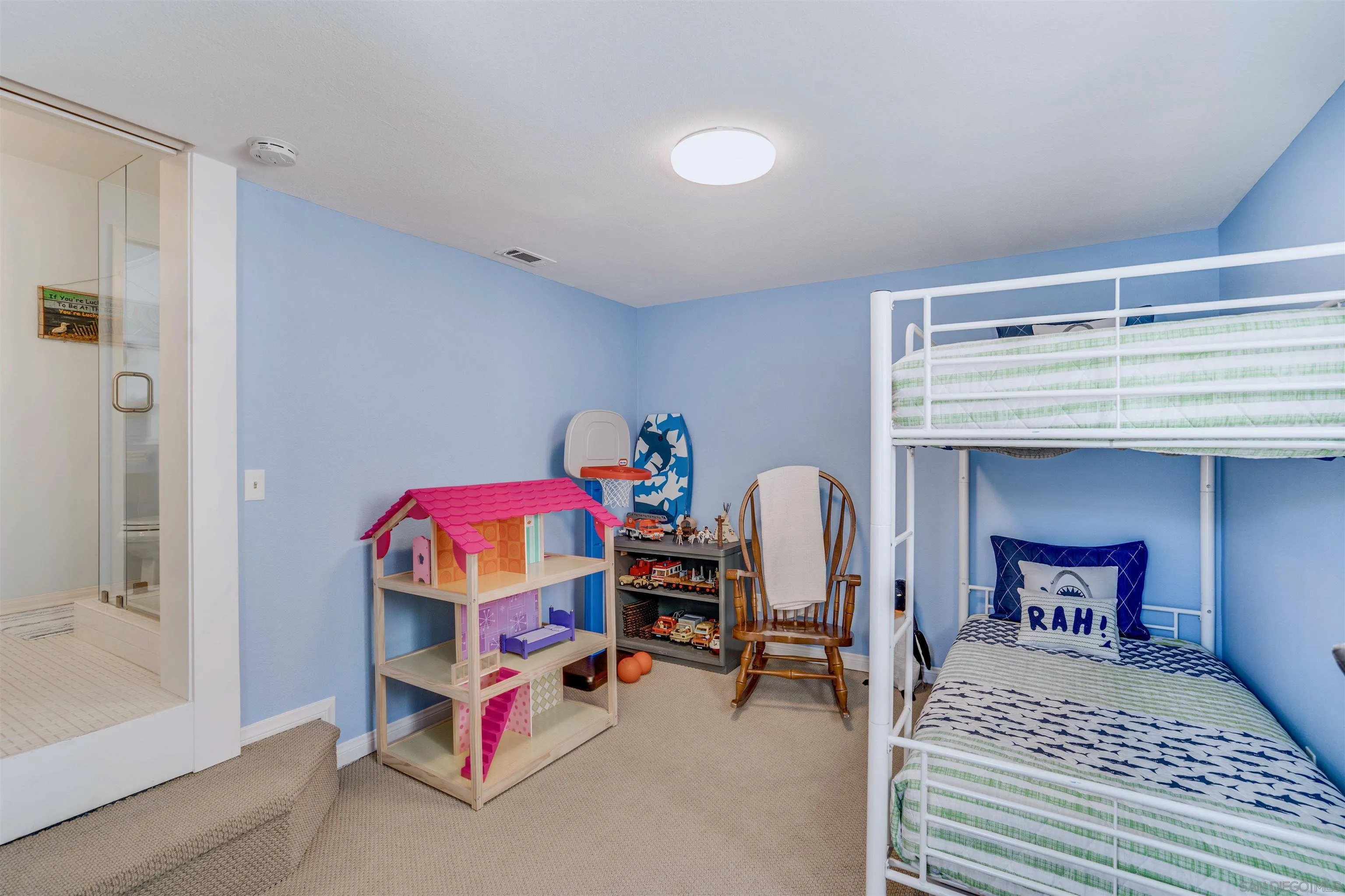 1210 Third Street Coronado, CA 92118 - Photo 23 of 40 a bedroom with furniture and a lamp