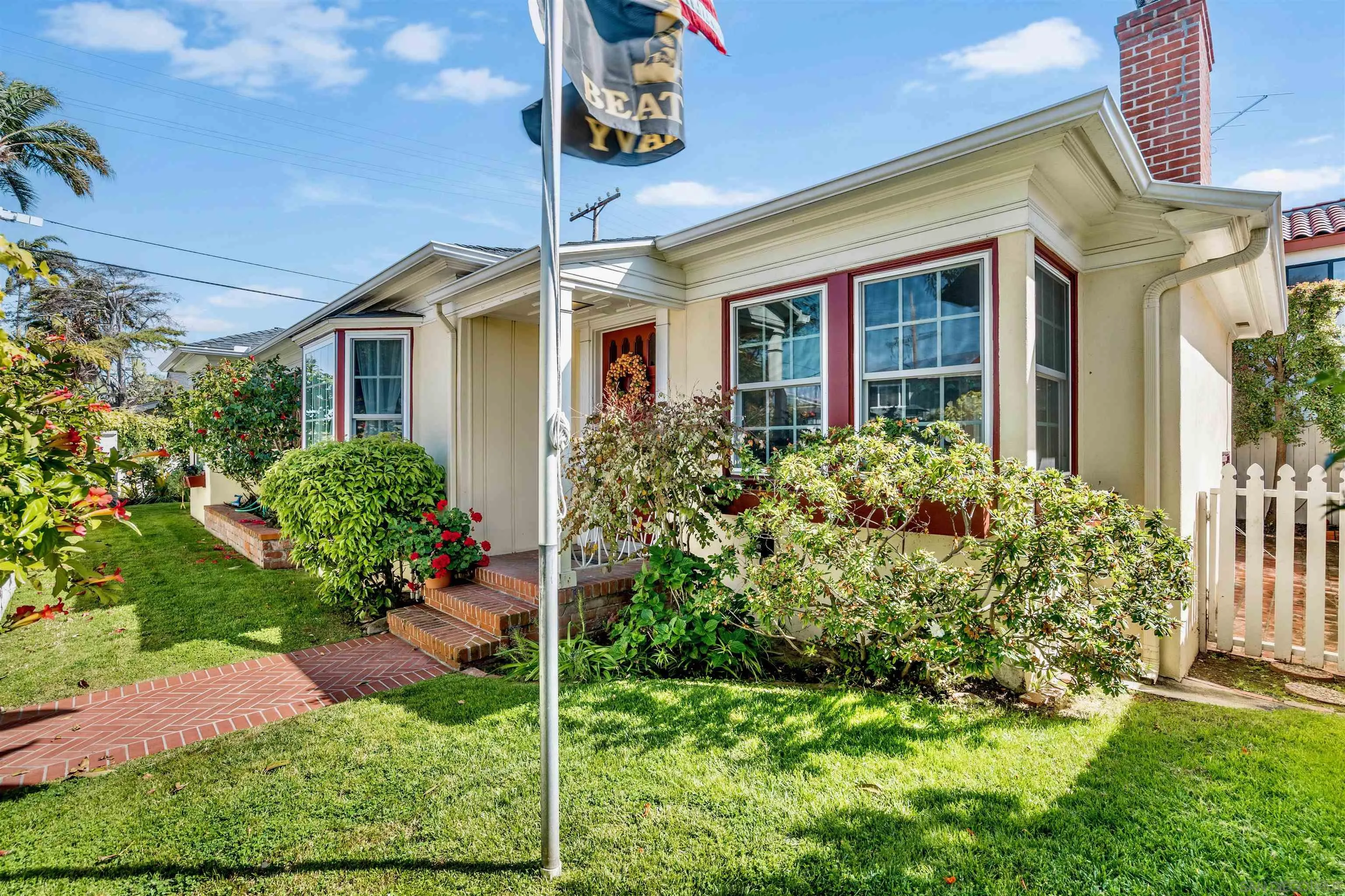 1210 Third Street Coronado, CA 92118 - Photo 30 of 40 a front view of a house with a yard