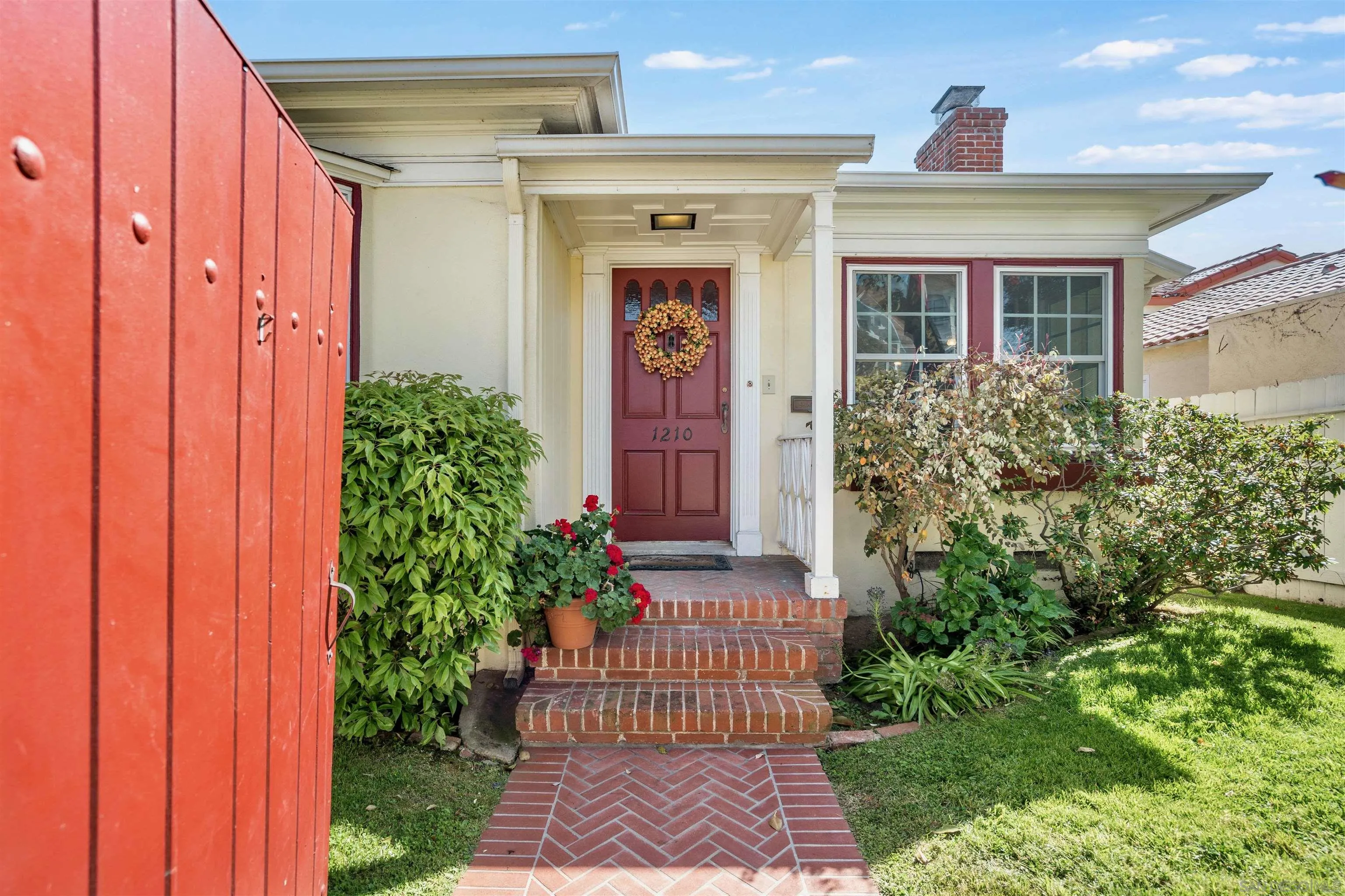 1210 Third Street Coronado, CA 92118 - Photo 31 of 40 a front view of a house with a garden