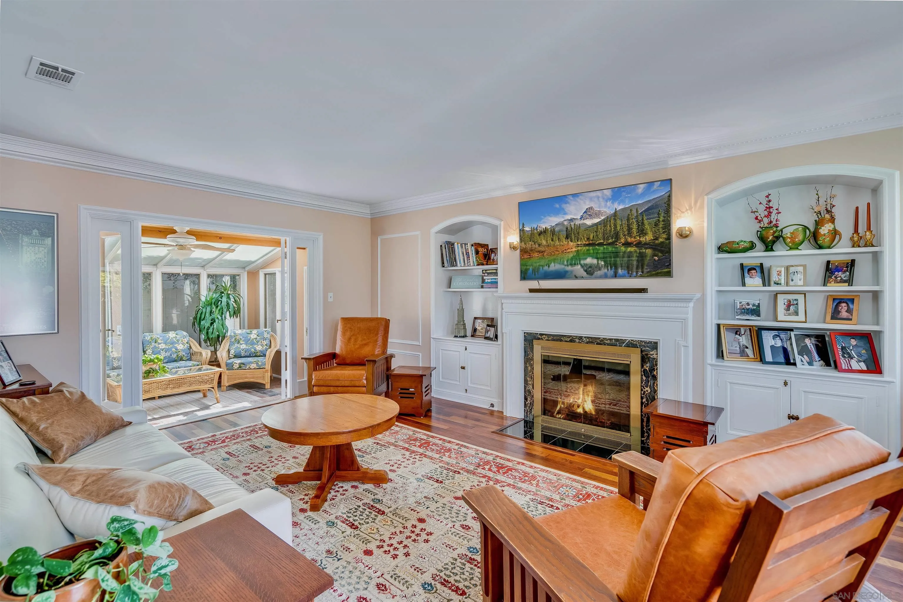 1210 Third Street Coronado, CA 92118 - Photo 4 of 40 a living room with furniture and a fireplace