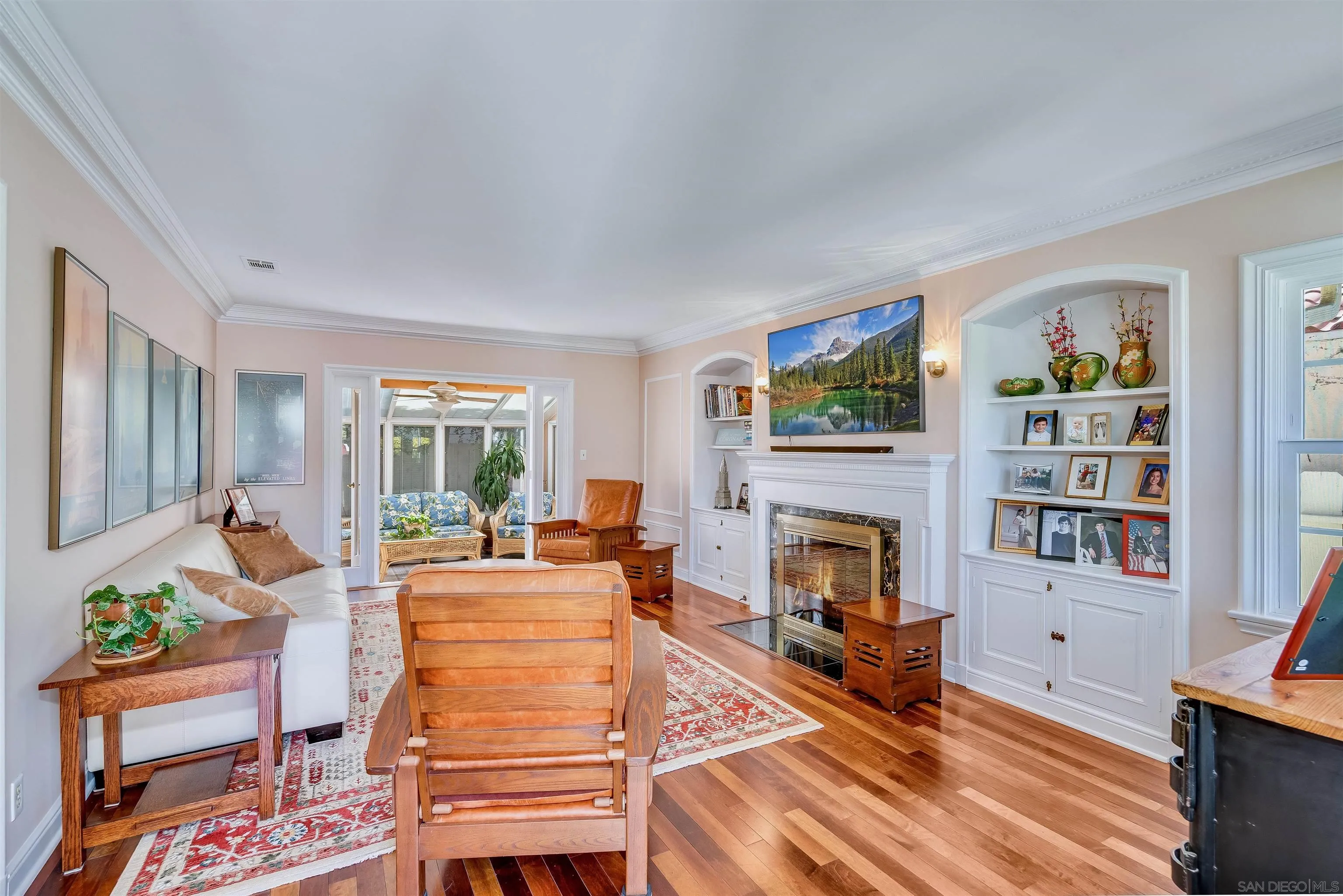 1210 Third Street Coronado, CA 92118 - Photo 6 of 40 a living room with fireplace furniture and a window