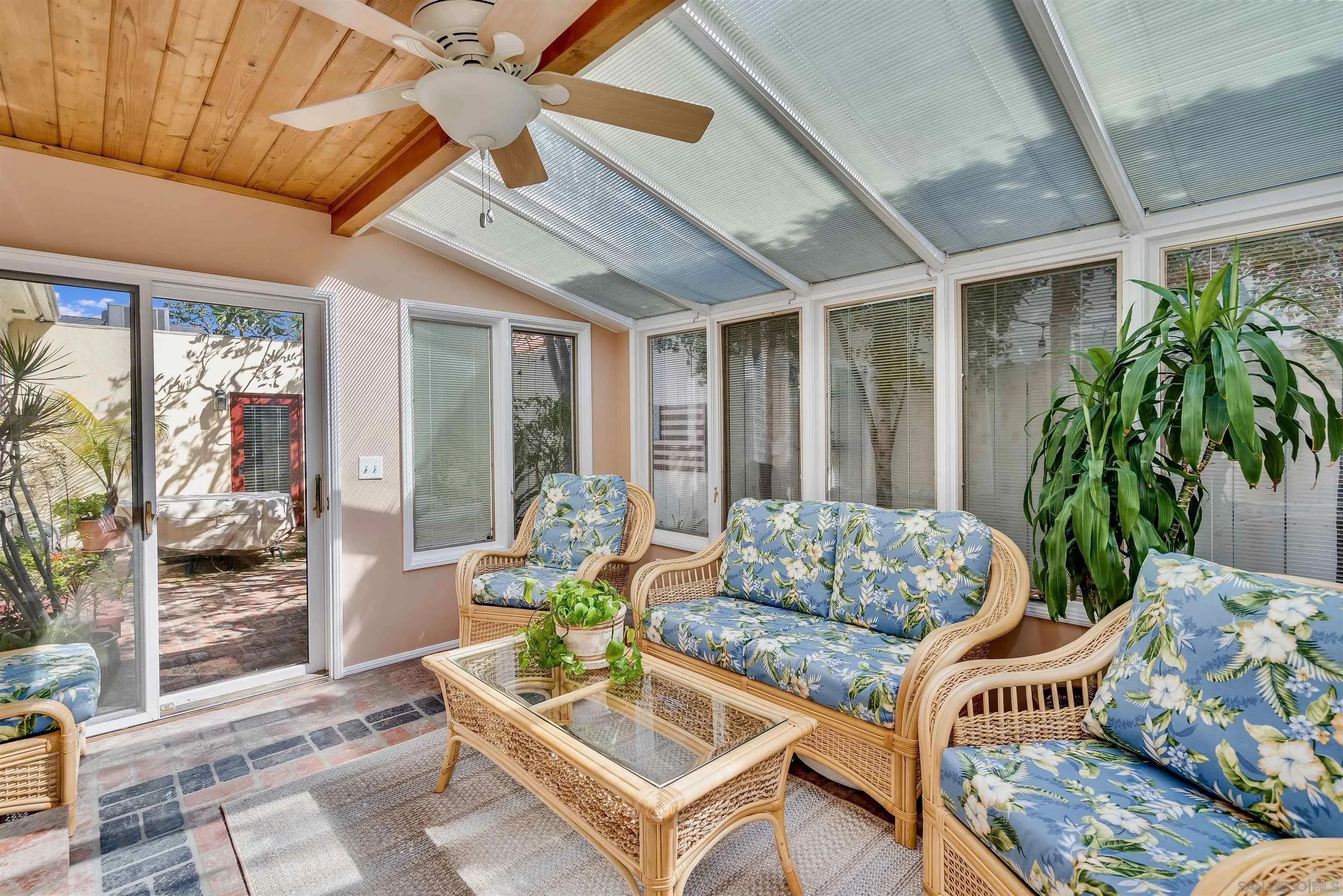 1210 Third Street Coronado, CA 92118 - Photo 8 of 40 a living room with furniture and a potted plant