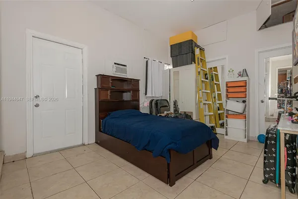 a bedroom with a bed and a walk in closet